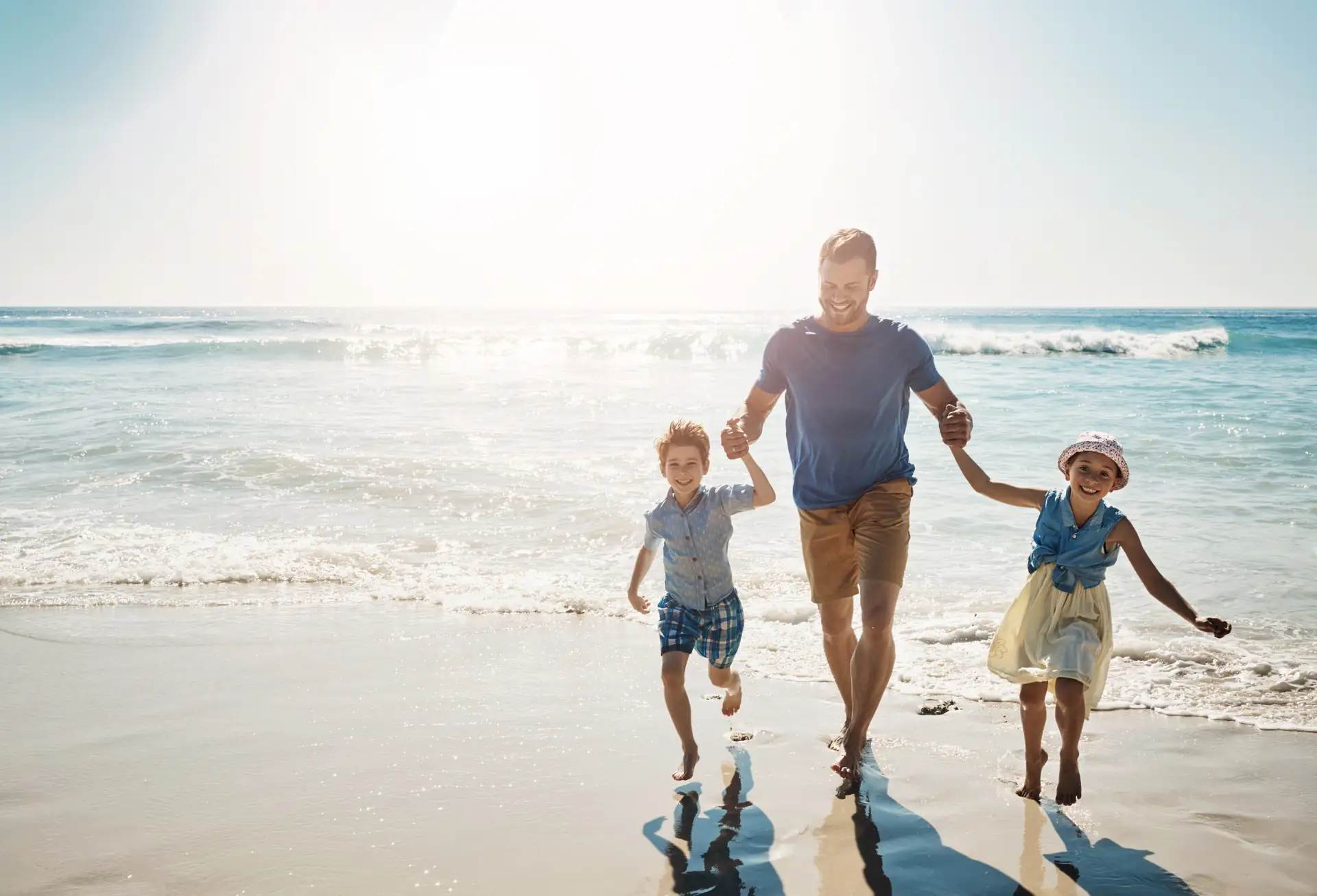 A family walking together along the beach